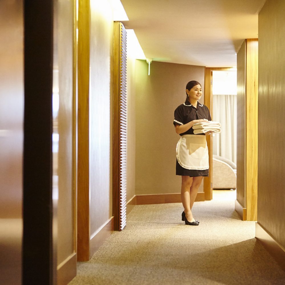 hotel maid in hallway hotel housekeeping costs