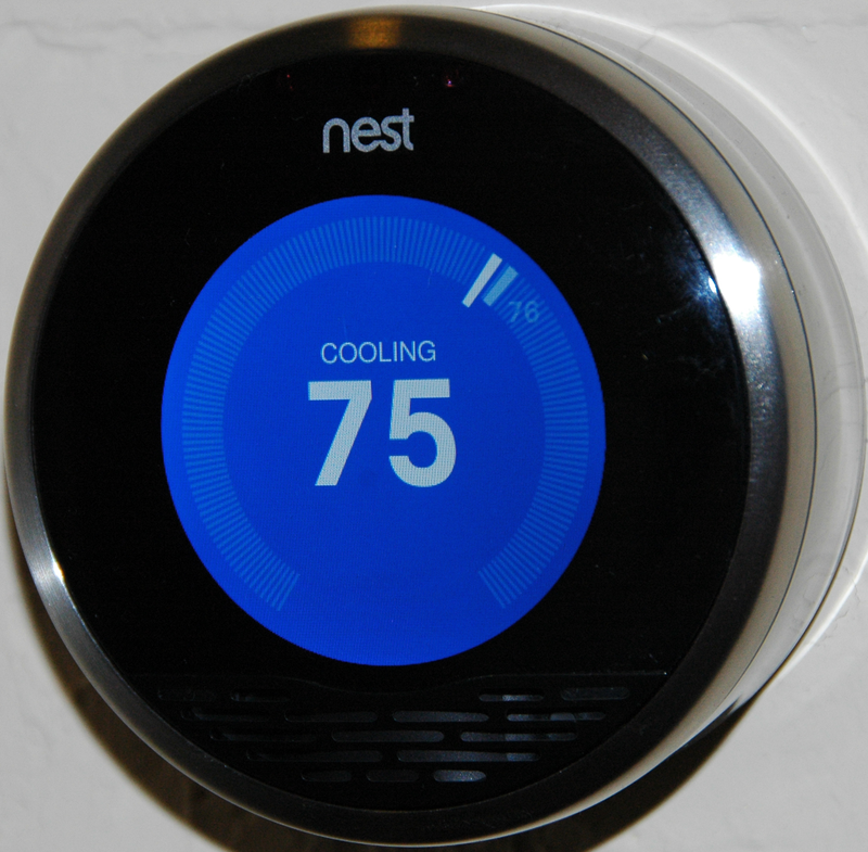 A NEST thermostat set to 75 degrees on cooling mode.