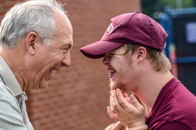 Intergenerational programs allow seniors to make a difference in the lives of others, like young boys playing sports.